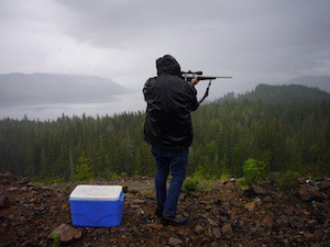 Still photo from film showing man with a rifle in the hunting