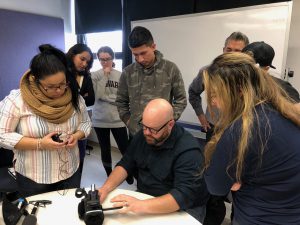 CNN's Great Big Story producer teaching students from the Hunter News Now team how to handle a camera.