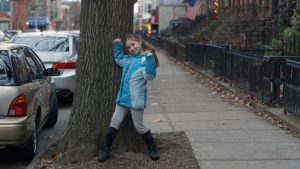 UNSTUCK film image of girl standing on street