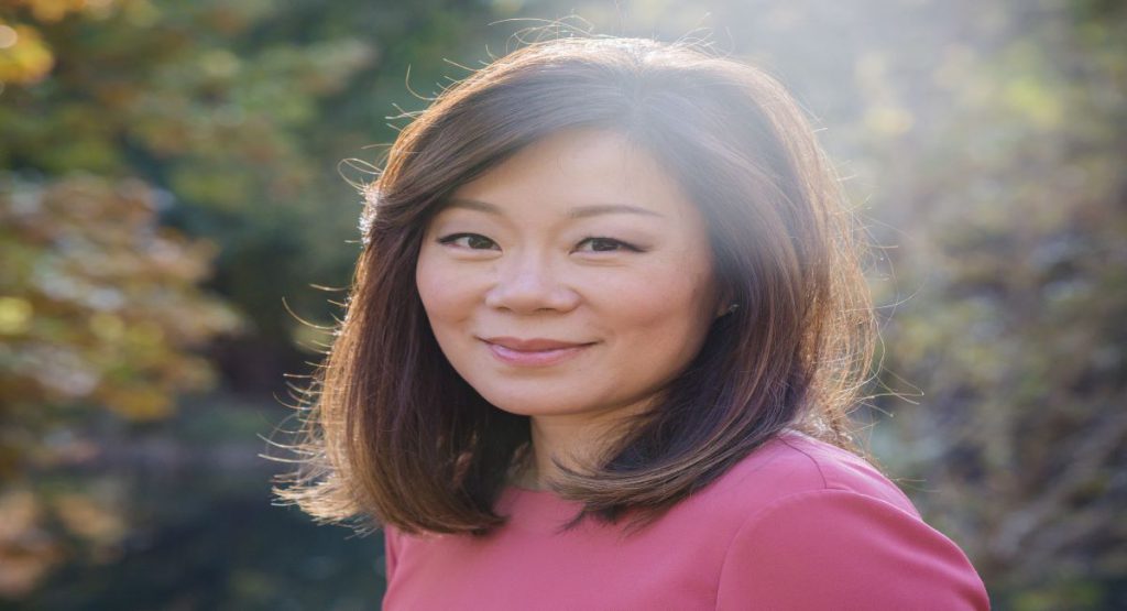 Professor Jeanie Ahn smiles into the camera in a professional headshot.