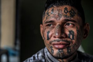 A born-again member of the 18th Street gang now living in the Eben Ezer evangelical church. Image by Danny Gold. El Salvador, 2018.