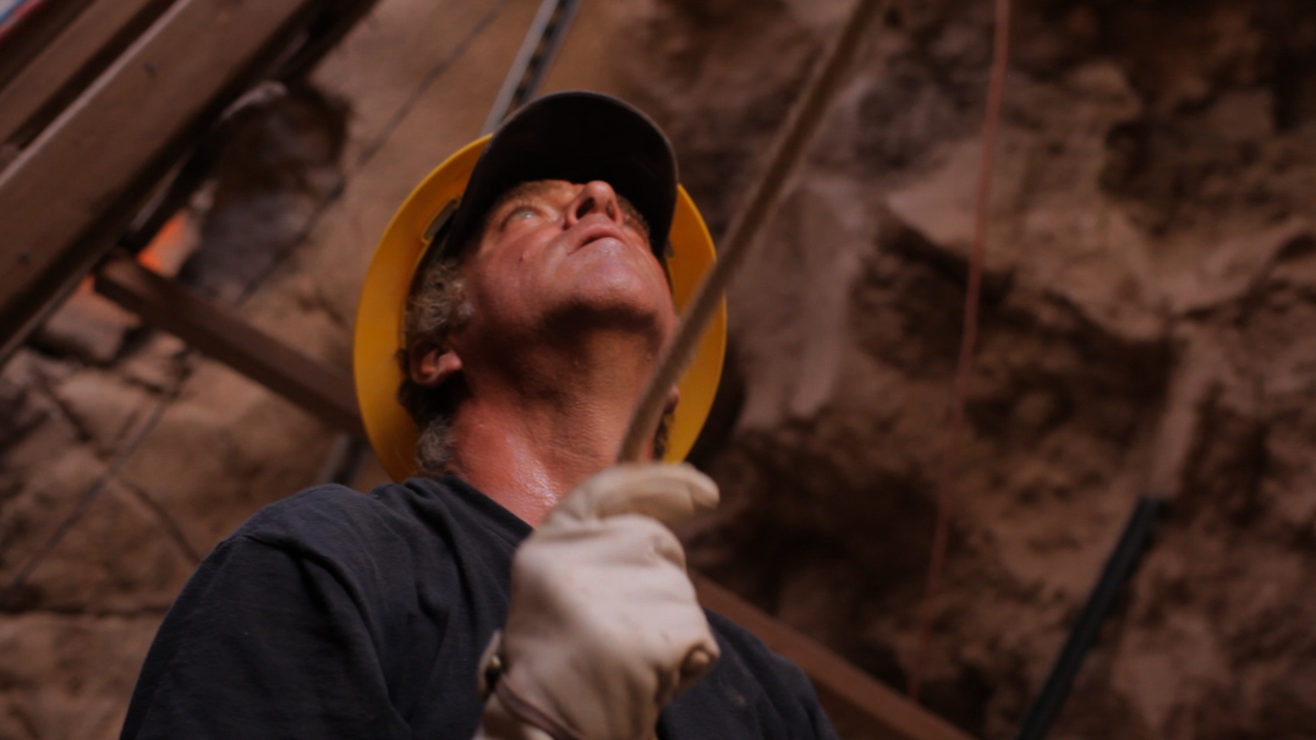 photo of a man working with a hard hat