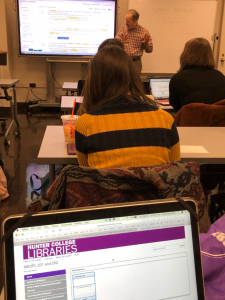 Hunter College librarian Tony Doyle teaching Sissel McCarthy's Reporting and Writing 2 students on research tools from the library.